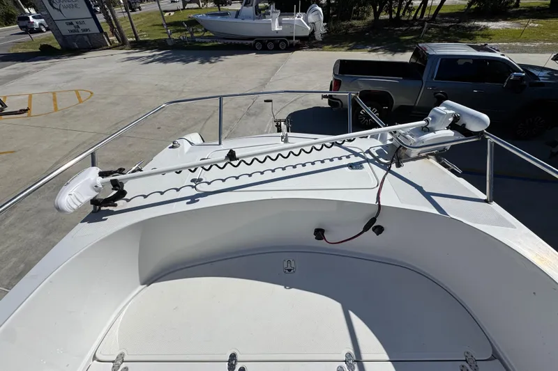 Slide: The Image of 2005 Glacier Bay 260 Canyon Runner boat deck with trolling motor, parked in marina. - 19