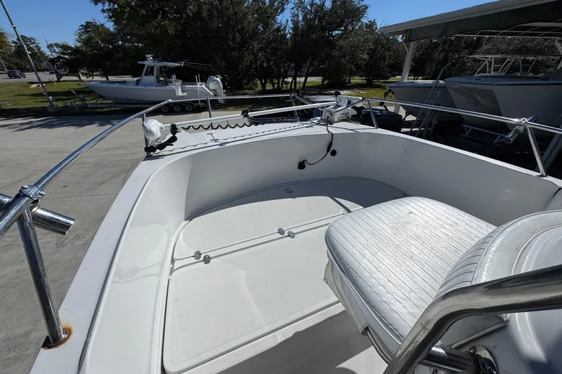 Slide: The Image of 2005 Glacier Bay 260 Canyon Runner boat interior with seating and railing. - 20
