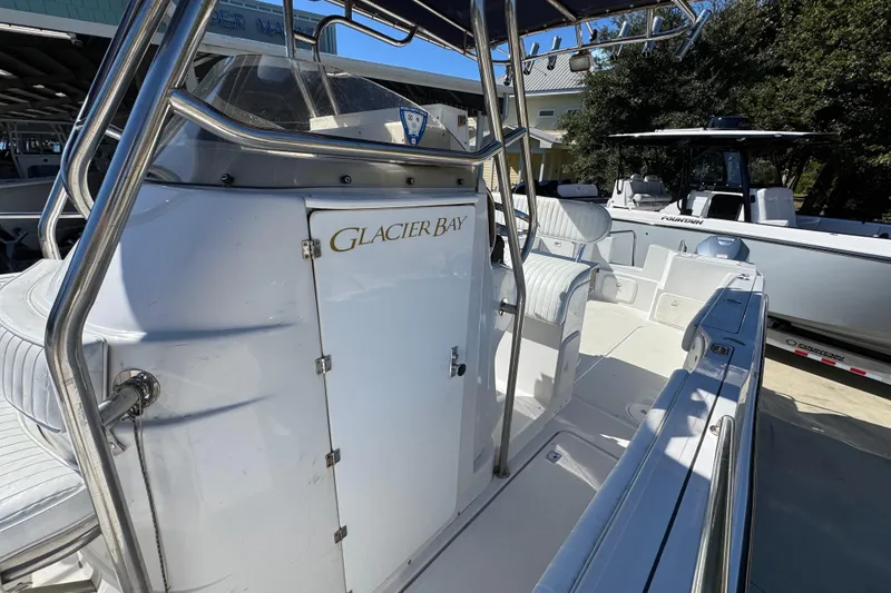 Slide: The Image of 2005 Glacier Bay 260 Canyon Runner boat with white interior and seating. - 24