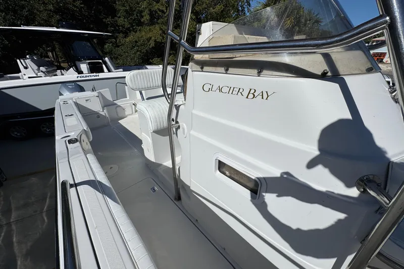 Slide: The Image of 2005 Glacier Bay 260 Canyon Runner boat with white interior and seating. - 25