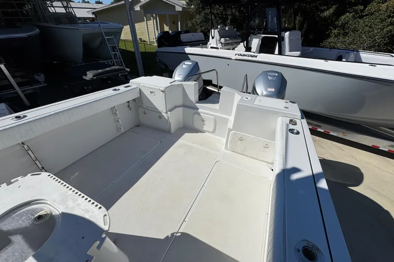 Slide: The Image of 2005 Glacier Bay 260 Canyon Runner boat interior with dual outboard motors. - 34