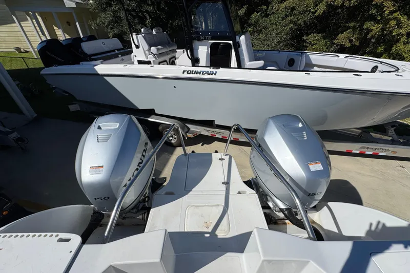 Slide: The Image of Two boats with Honda outboard motors, including a 2005 Glacier Bay 260 Canyon Runner. - 36