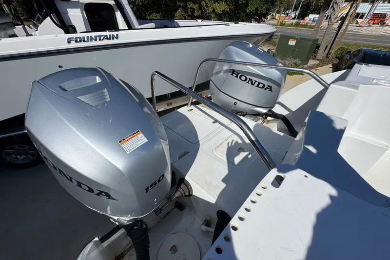 Slide: The Image of 2005 Glacier Bay 260 Canyon Runner with dual Honda 150 outboard engines. - 38