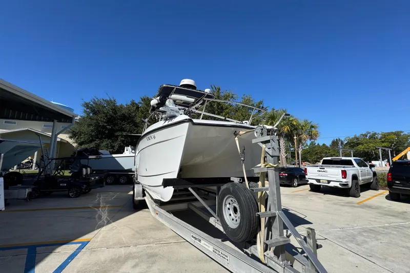 Slide: The Image of 2005 Glacier Bay 260 Canyon Runner boat on trailer in parking lot. - 7