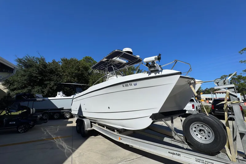 Slide: The Image of 2005 Glacier Bay 260 Canyon Runner boat on trailer under clear blue sky. - 8