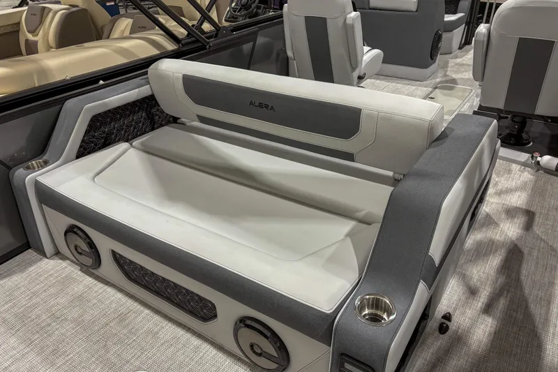 Slide: The Image of 2026 Alera M23L boat interior with gray and white seating, cup holders, and modern design. - 10