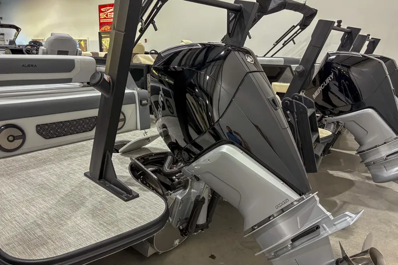Slide: The Image of Alera M23L 2026 boat with Mercury outboard engines in showroom display. - 13