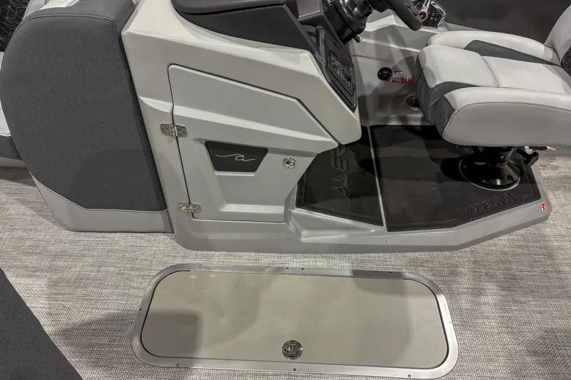Slide: The Image of 2026 Alera M23L boat interior with gray seating and control panel. - 6