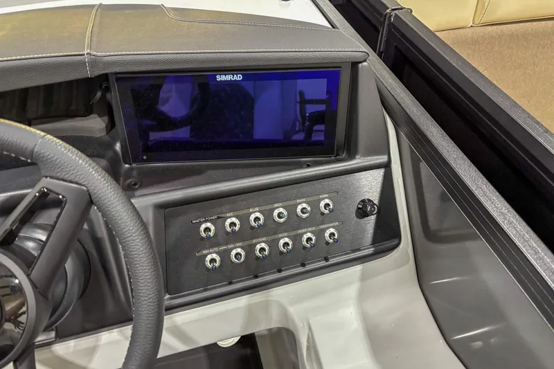Slide: The Image of Dashboard of 2026 Alera M23L boat with Simrad display and control switches. - 8