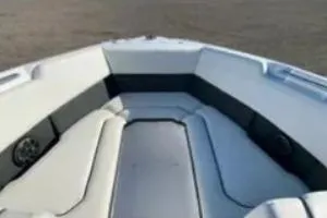 Slide: The Image of 2019 Rinker Q3 OB boat interior with cushioned seating and sleek design. - 8