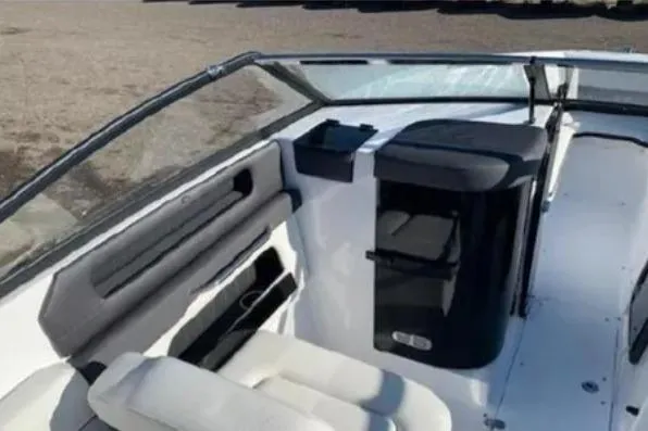 Slide: The Image of 2019 Rinker Q3 OB boat interior with seating and console, featuring sleek design elements. - 9