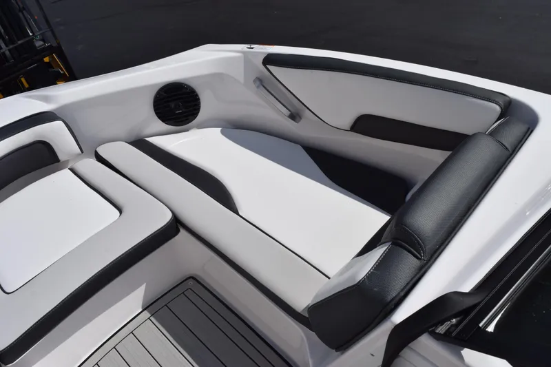 Slide: The Image of 2026 Yamaha Boats 195S interior seating with sleek black and white design. - 12