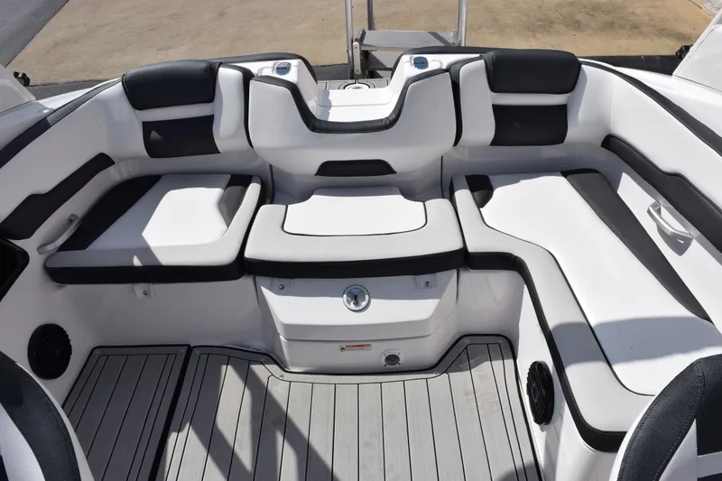 Slide: The Image of 2026 Yamaha Boats 195S interior seating with sleek black and white design. - 16