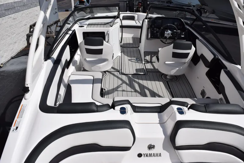 Slide: The Image of Interior of 2026 Yamaha Boats 195S, featuring sleek seating and modern dashboard design. - 7