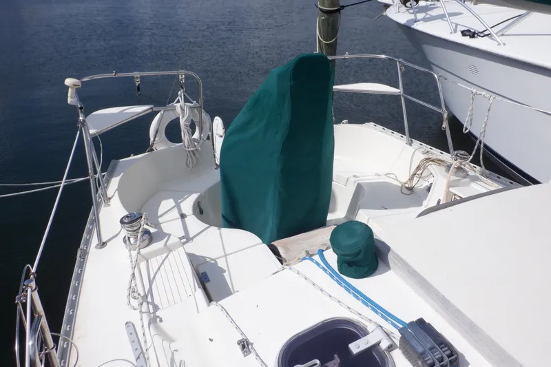 Slide: The Image of 2002 Seaward Eagle 32 RK sailboat deck with green covers and nautical equipment. - 10
