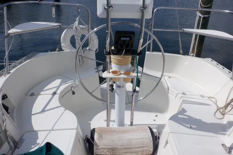 Slide: The Image of Cockpit of 2002 Seaward Eagle 32 RK sailboat with steering wheel and navigation equipment. - 12