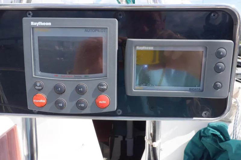 Slide: The Image of Raytheon autopilot and bidata displays on 2002 Seaward Eagle 32 RK sailboat. - 16