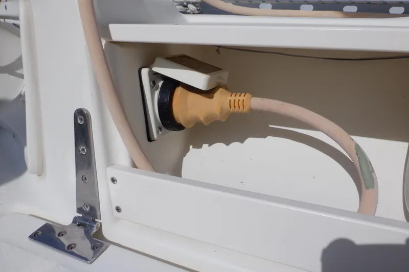 Slide: The Image of Power connection on a 2002 Seaward Eagle 32 RK boat, featuring a yellow plug and cable. - 17