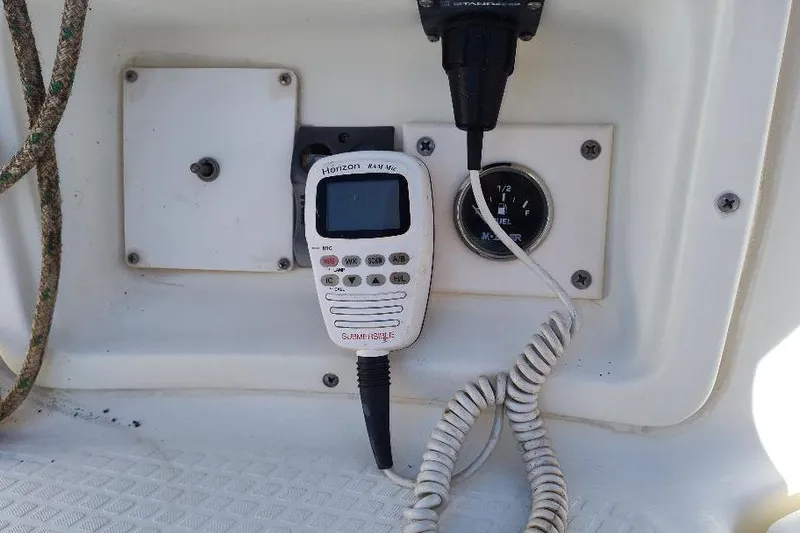 Slide: The Image of VHF marine radio and gauge on 2002 Seaward Eagle 32 RK boat dashboard. - 19