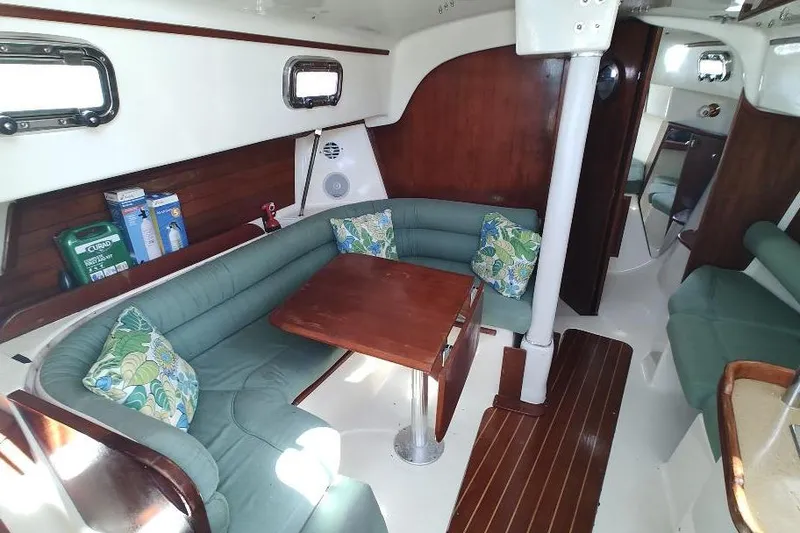 Slide: The Image of Interior of 2002 Seaward Eagle 32 RK sailboat with cozy seating and wooden table. - 22