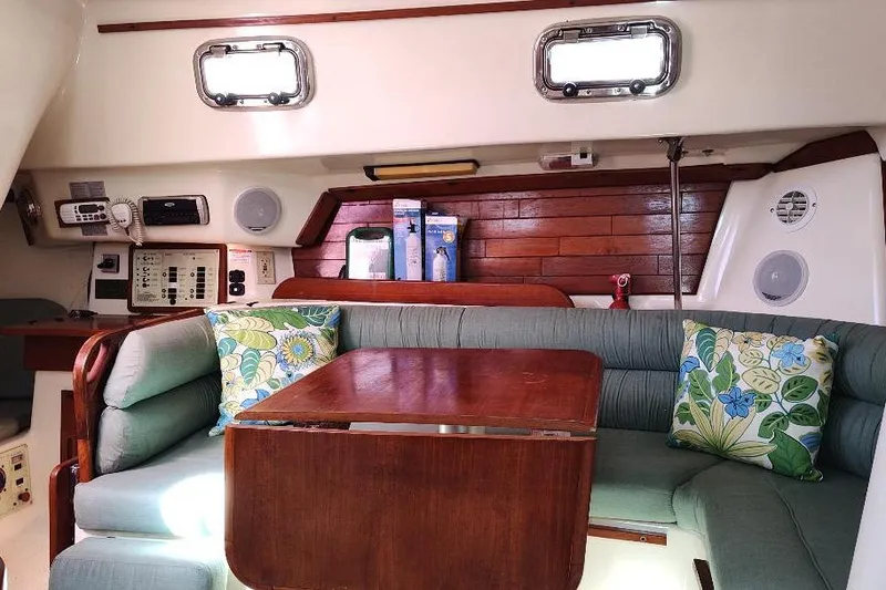 Slide: The Image of Interior of 2002 Seaward Eagle 32 RK sailboat with cozy seating and wooden table. - 24