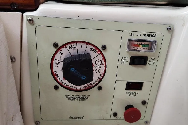 Slide: The Image of Control panel of a 2002 Seaward Eagle 32 RK boat with battery switches. - 27
