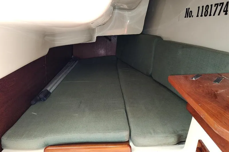 Slide: The Image of Interior cabin of 2002 Seaward Eagle 32 RK sailboat with green cushions. - 28