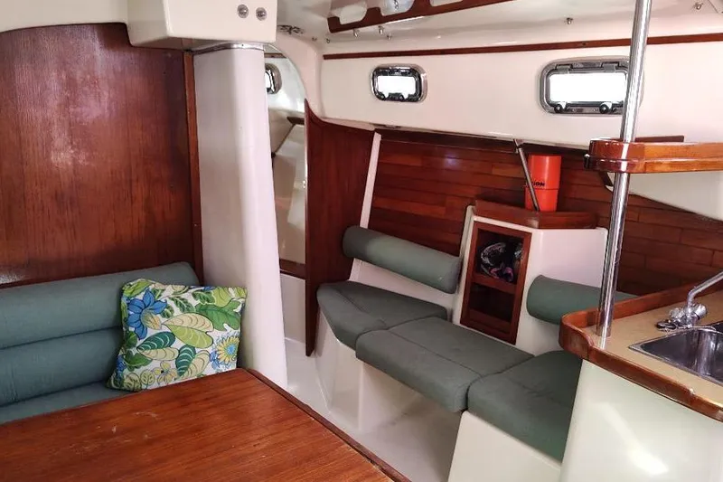 Slide: The Image of Interior of 2002 Seaward Eagle 32 RK sailboat with cozy seating and wooden accents. - 35