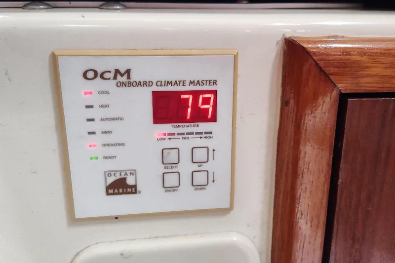 Slide: The Image of Onboard climate control panel displaying 79 degrees on a 2002 Seaward Eagle 32 RK. - 40