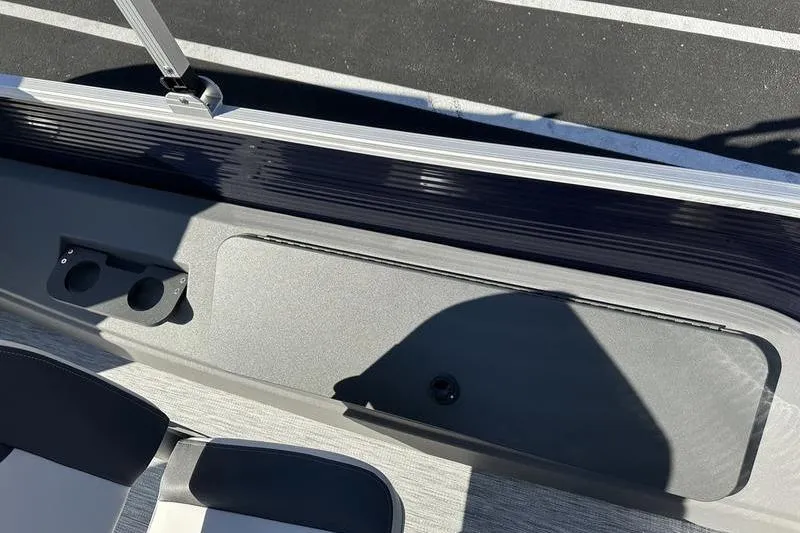 Slide: The Image of 2025 Bennington S Fish 22 SF boat interior with seating and cup holders. - 22