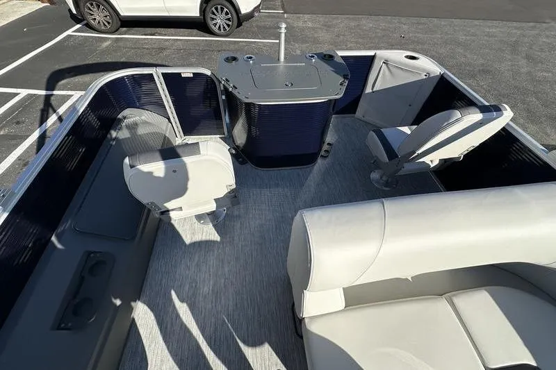 Slide: The Image of 2025 Bennington S Fish 22 SF pontoon boat interior with seating and table. - 23