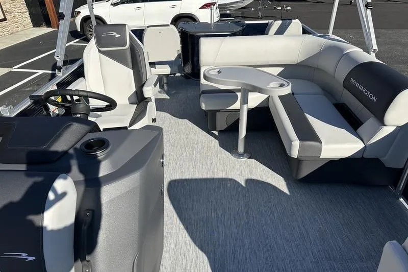 Slide: The Image of 2025 Bennington S Fish 22 SF pontoon boat interior with seating and steering console. - 7