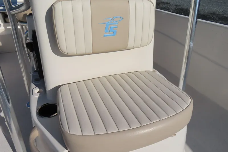 Slide: The Image of 2017 Carolina Skiff 238 DLV boat seat with logo, beige and white upholstery. - 14