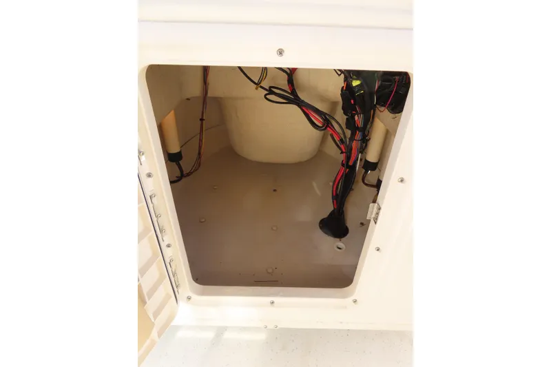 Slide: The Image of Interior view of 2017 Carolina Skiff 238 DLV boat compartment with wiring. - 21