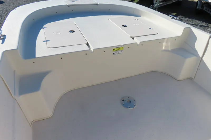 Slide: The Image of 2017 Carolina Skiff 238 DLV boat interior with storage compartments. - 6