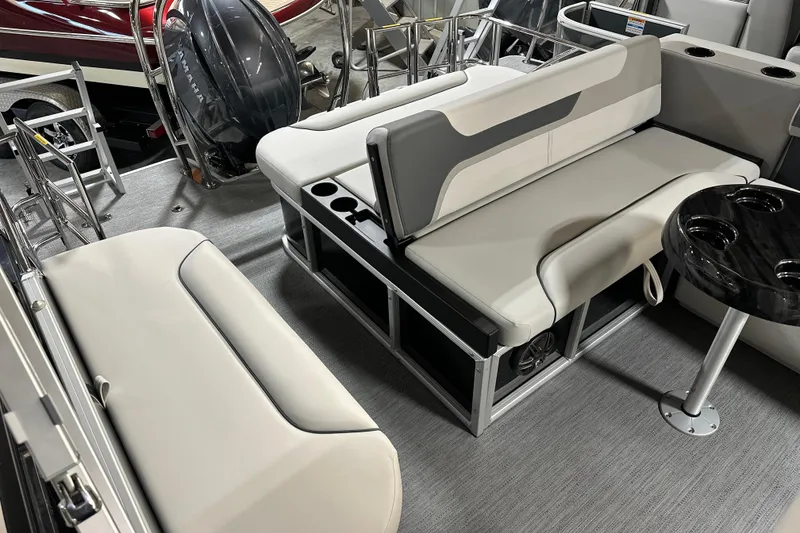 Slide: The Image of 2026 Godfrey SWEETWATER 2286 SFL pontoon boat interior with seating and table. - 10