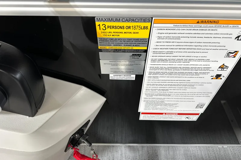 Slide: The Image of Capacity warning label on 2026 Godfrey SWEETWATER 2286 SFL boat, 13 persons or 1875 lbs. - 13