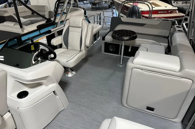 Slide: The Image of Interior of 2026 Godfrey SWEETWATER 2286 SFL pontoon boat with modern seating and helm. - 16
