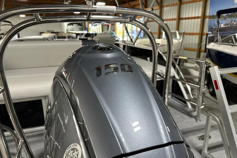 Slide: The Image of Outboard motor on 2026 Godfrey SWEETWATER 2286 SFL pontoon boat in showroom. - 4