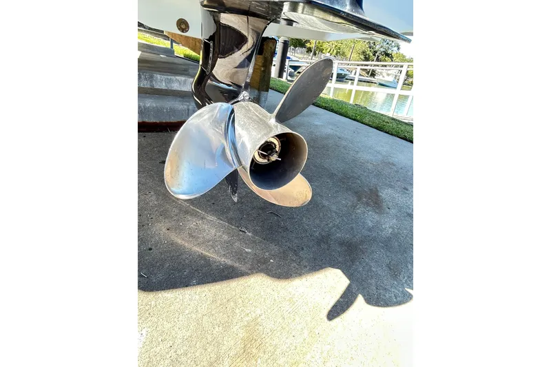 Slide: The Image of 2019 Robalo 226 Cayman boat propeller on concrete surface near water. - 19