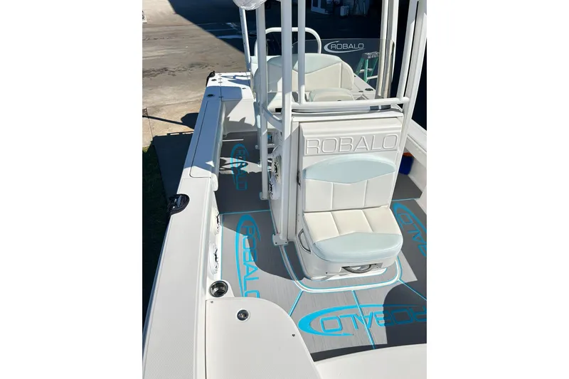 Slide: The Image of 2019 Robalo 226 Cayman boat interior with branded seating and deck design. - 28