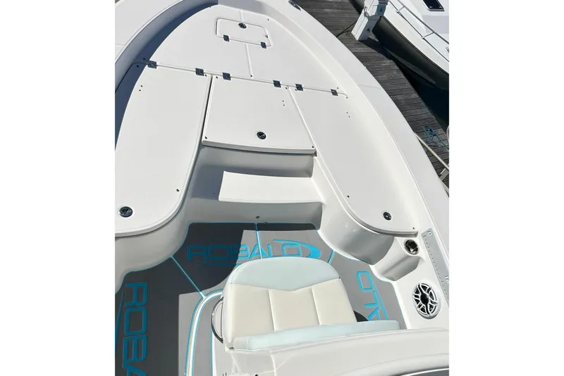 Slide: The Image of 2019 Robalo 226 Cayman boat deck with seating and storage compartments. - 29