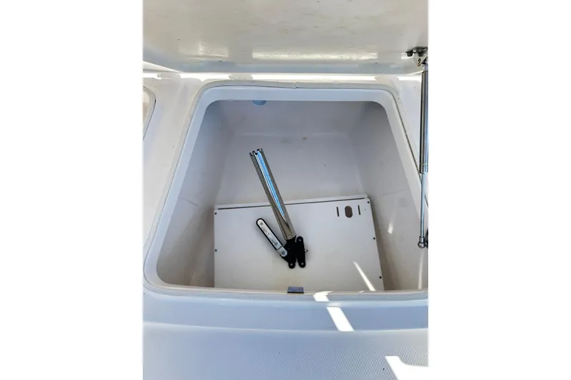 Slide: The Image of Open storage compartment on 2019 Robalo 226 Cayman boat. - 33