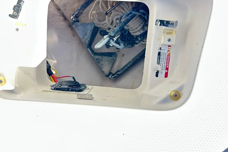 Slide: The Image of 2019 Robalo 226 Cayman anchor compartment with ropes and wiring. - 40