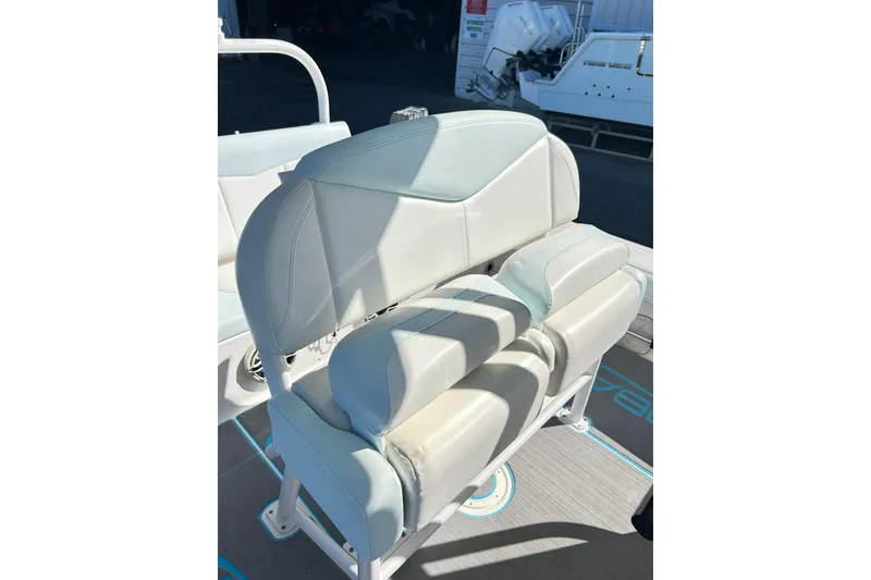 Slide: The Image of 2019 Robalo 226 Cayman boat seat with white upholstery and sleek design. - 49