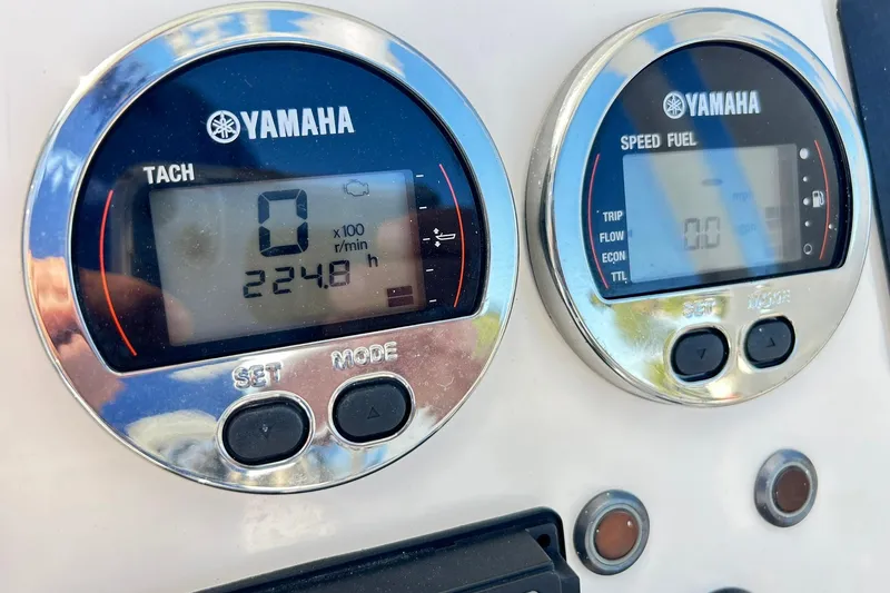 Slide: The Image of Yamaha tachometer and speed fuel gauges on 2019 Robalo 226 Cayman boat dashboard. - 55