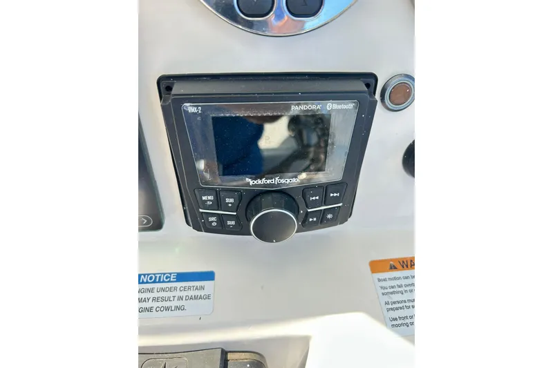 Slide: The Image of Control panel of 2019 Robalo 226 Cayman boat featuring Rockford Fosgate audio system. - 57