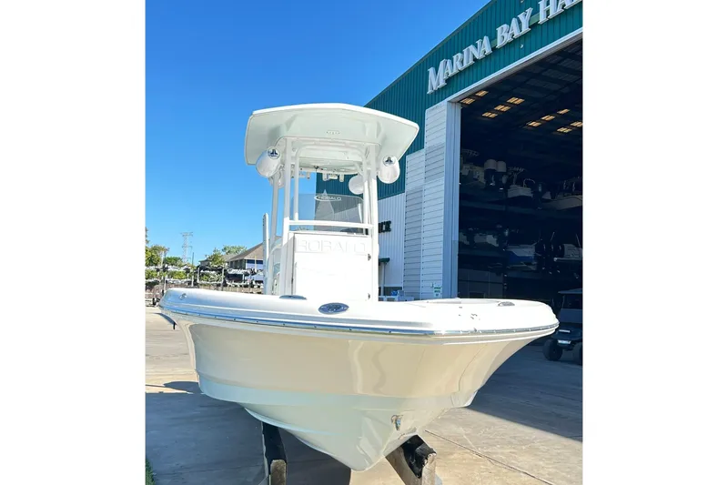 Slide: The Image of 2019 Robalo 226 Cayman boat at Marina Bay Harbor under clear blue sky. - 6