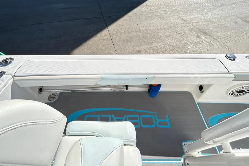 Slide: The Image of 2019 Robalo 226 Cayman boat interior with seating and deck details. - 61