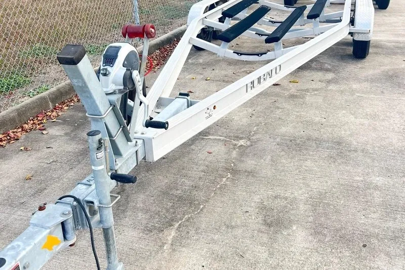 Slide: The Image of 2019 Robalo 226 Cayman boat trailer on concrete surface. - 66